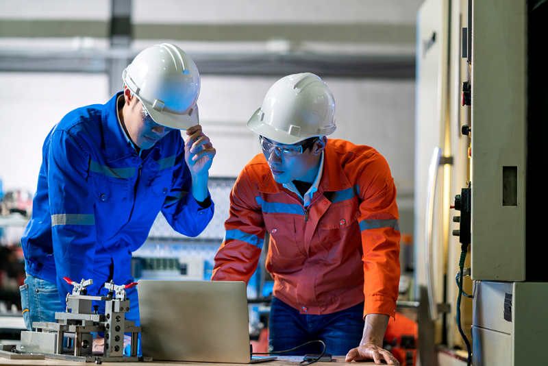 male-asian-engineer-professional-having-discussion-standing-concult-cnc-machine-factory-two-asian-coworker-brainstorm-explaining-solves-process-cnc-operate-machine.png