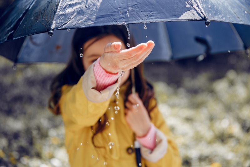 cute-kid-plaiyng-rainy-day (1).jpg